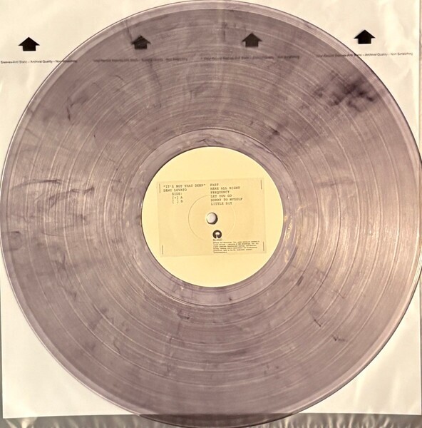 Demi Lovato – It’s Not That Deep (Clear With Black And Gold Smoke [Transparent White Noise Static], Alternate Cover)